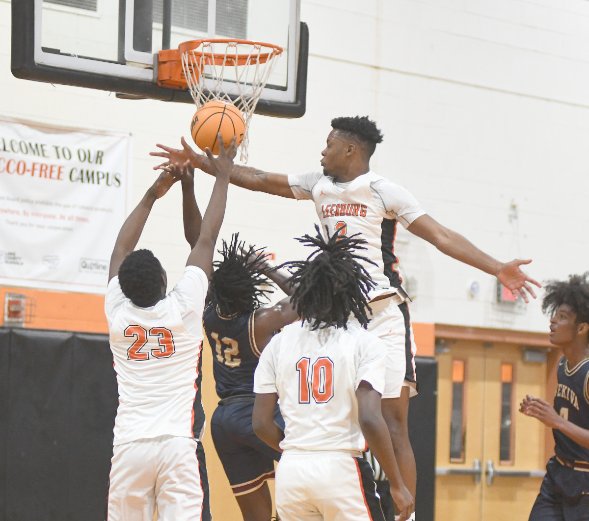 Leesburg's Camerin James (2) tries to block Wekiva's Abiah Charles (12) while Leesburg's Wilton Jean-Pierre (23) and Nigel Harris (10) assist on defense in the first half.